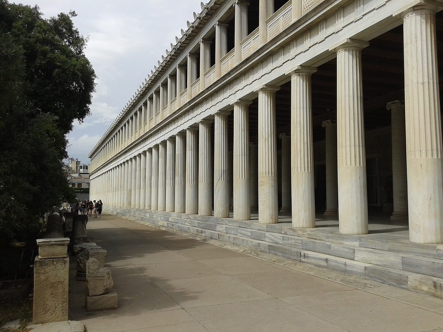 The long marble colonnade of the reconstructed Stoa of Attalos in the Ancient Agora, with a shaded path running along its two storeys of columns