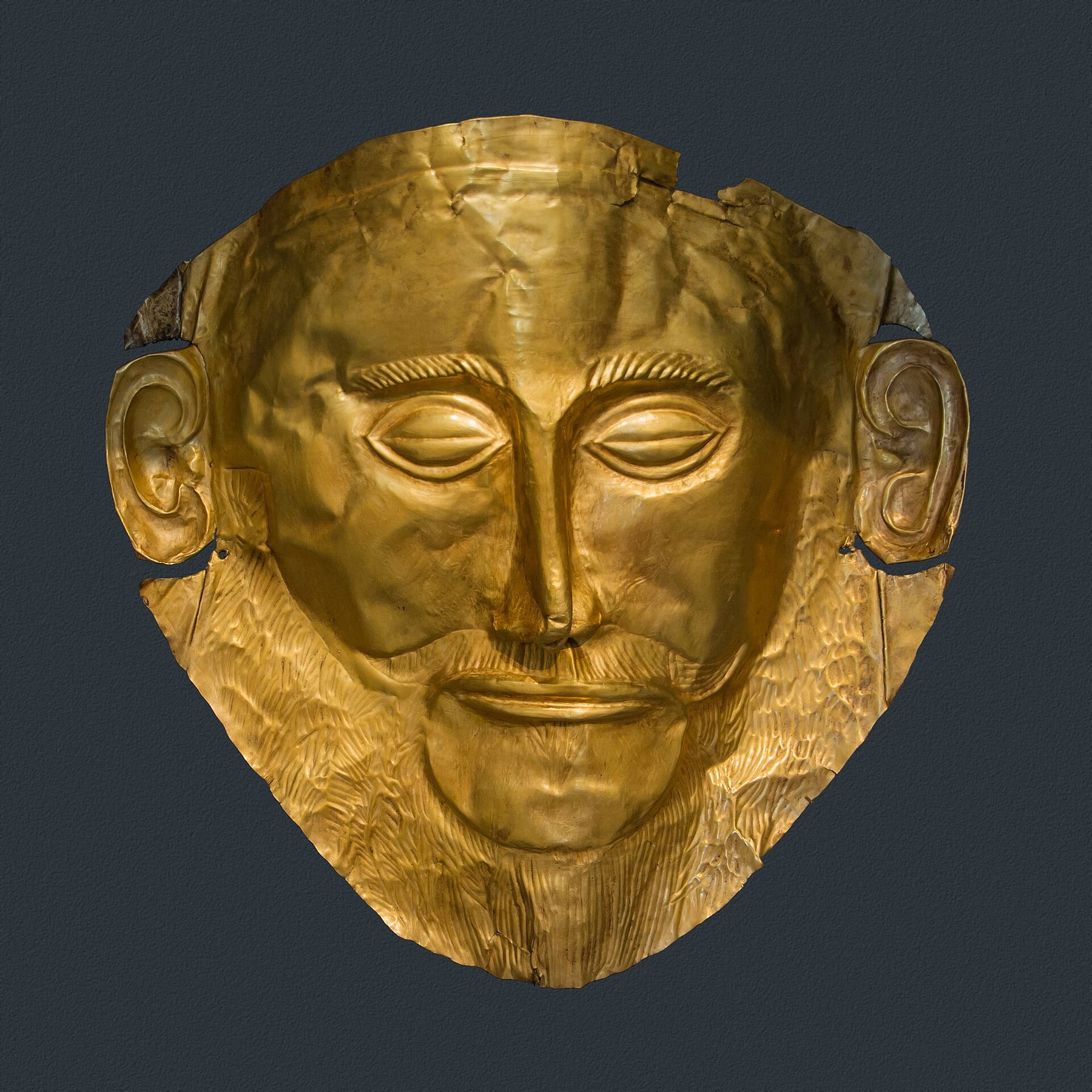The gold funeral mask known as the Mask of Agamemnon, from the royal tombs of Mycenae, in the National Archaeological Museum in Athens