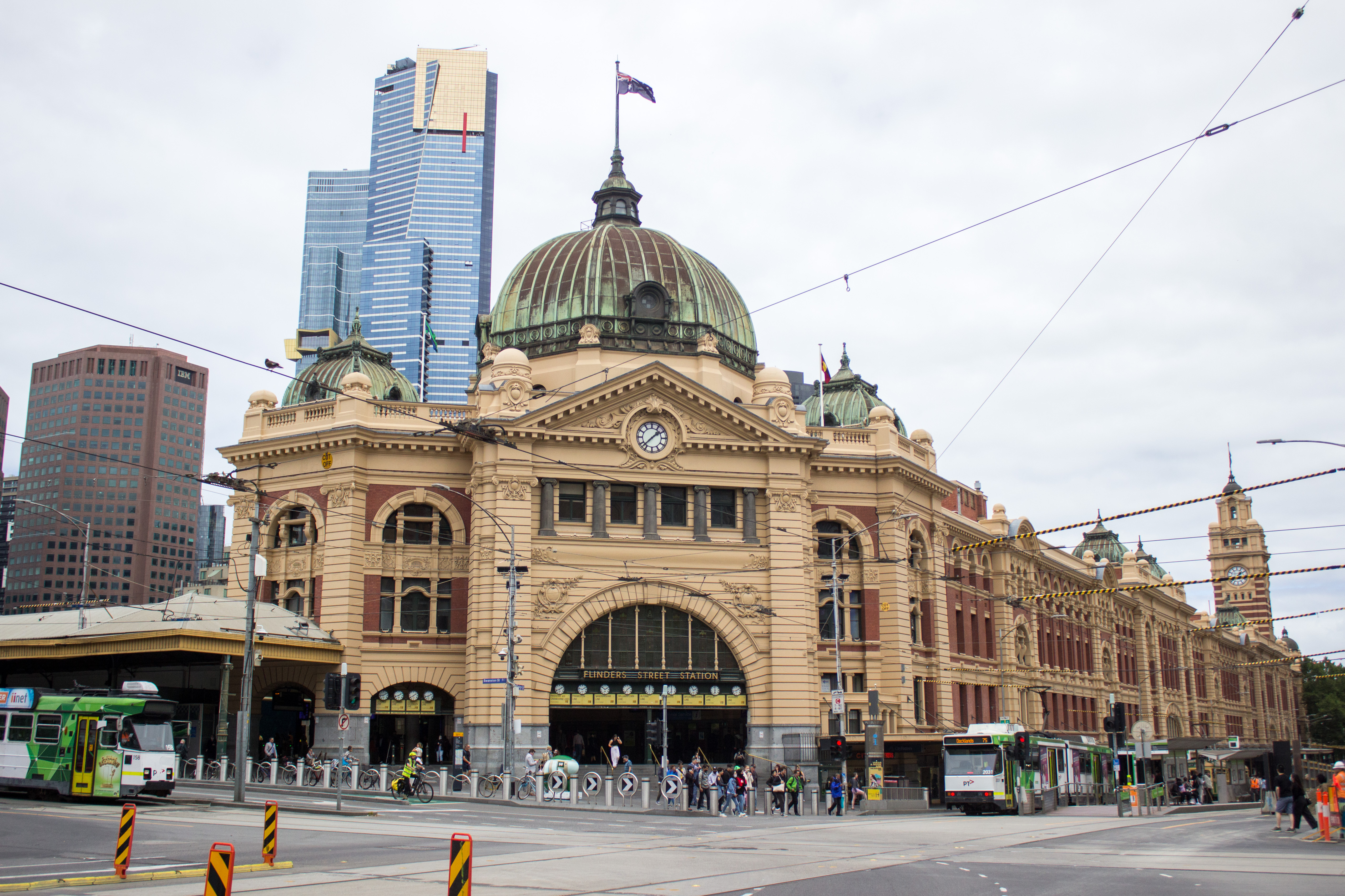 Flinders Street Station with the Eureka Tower skyline behind it in Melbourne