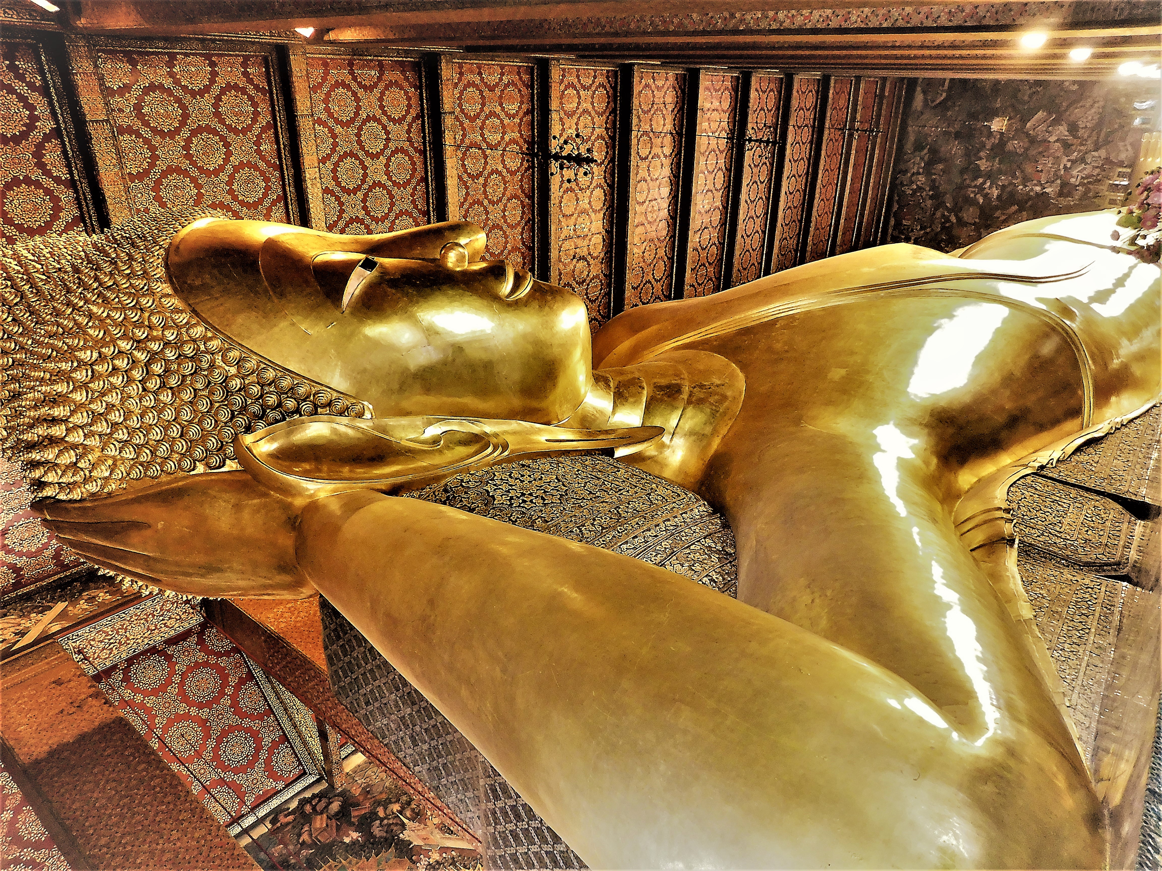 The golden Reclining Buddha statue inside Wat Pho, the second stop on this Rattanakosin loop