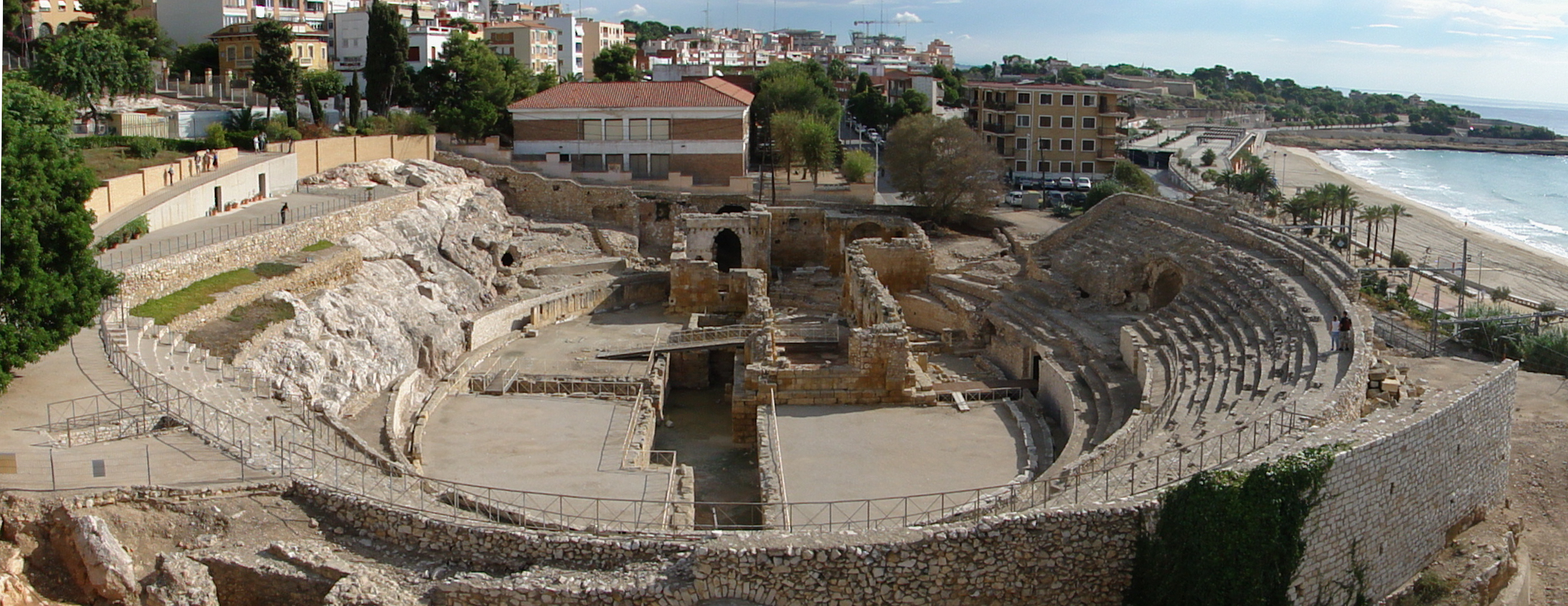 The Roman Amphitheatre in Tarragona, built into the hillside overlooking the Mediterranean