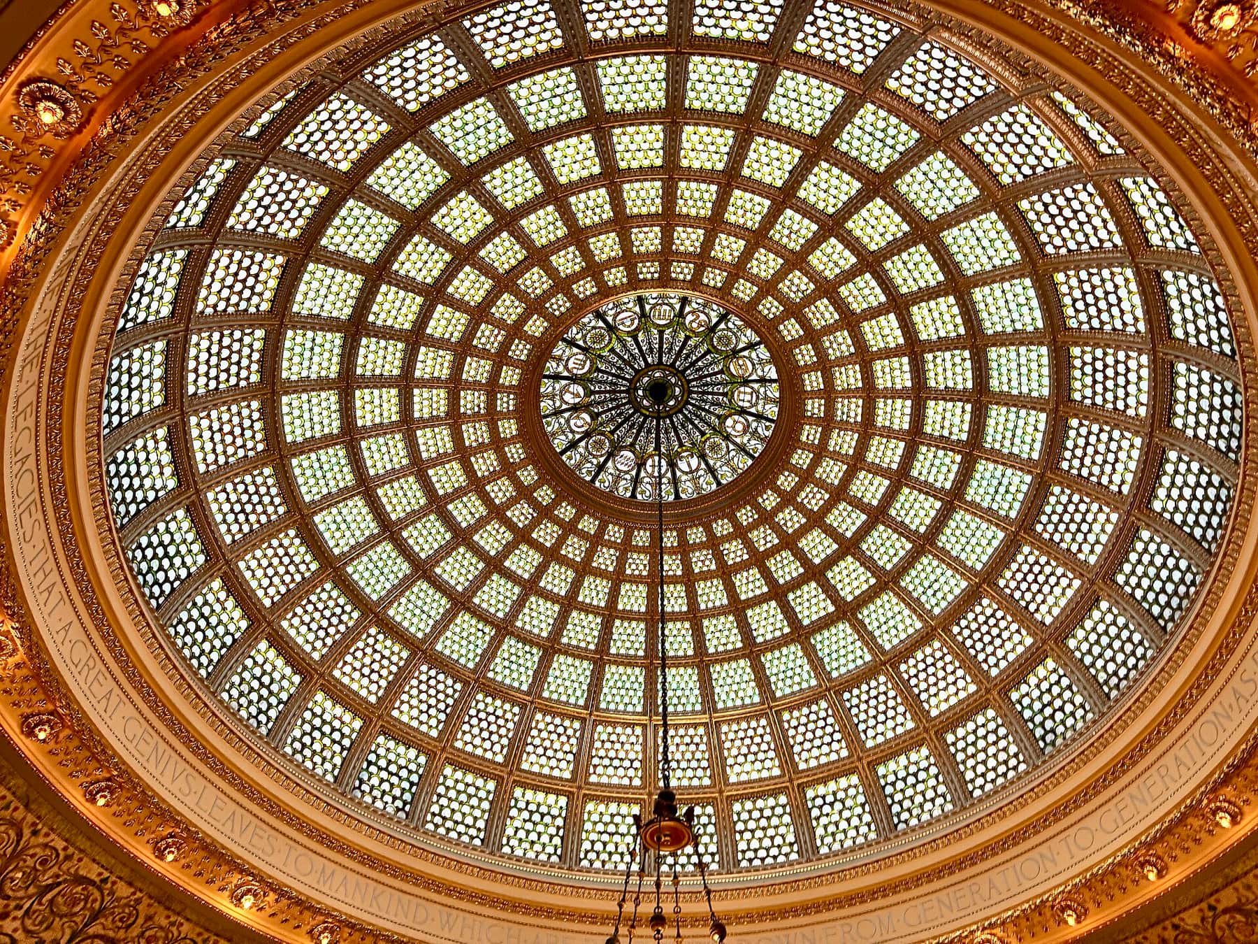 The stained-glass Tiffany dome above Preston Bradley Hall in the Chicago Cultural Center, seen from directly below