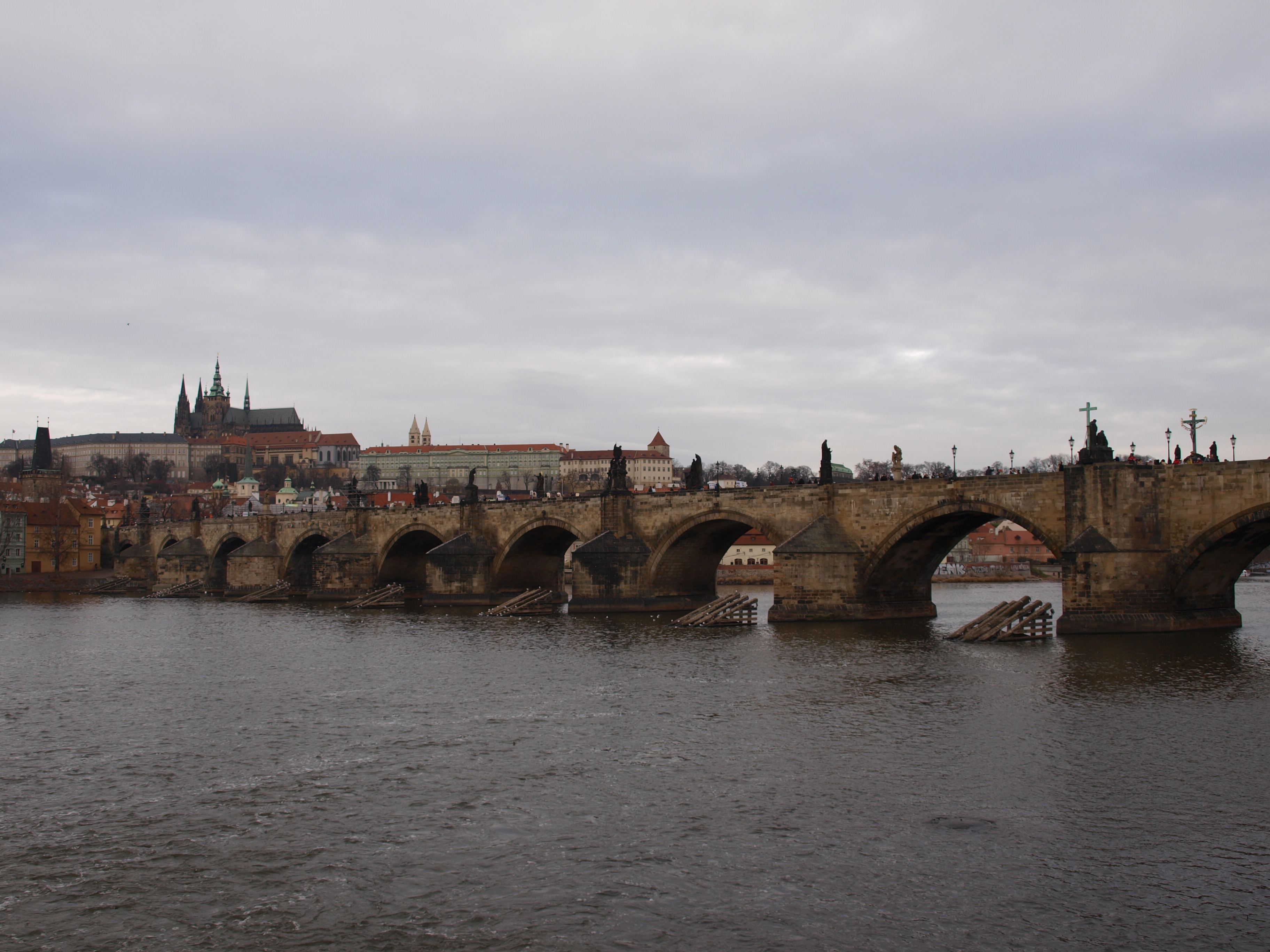 Charles Bridge leading toward the towers of Prague Old Town