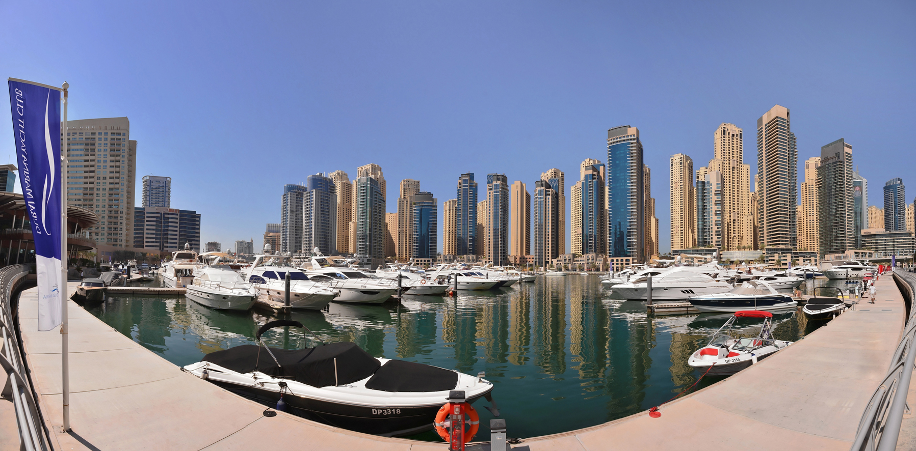 Dubai Marina’s waterfront towers and promenade at dusk