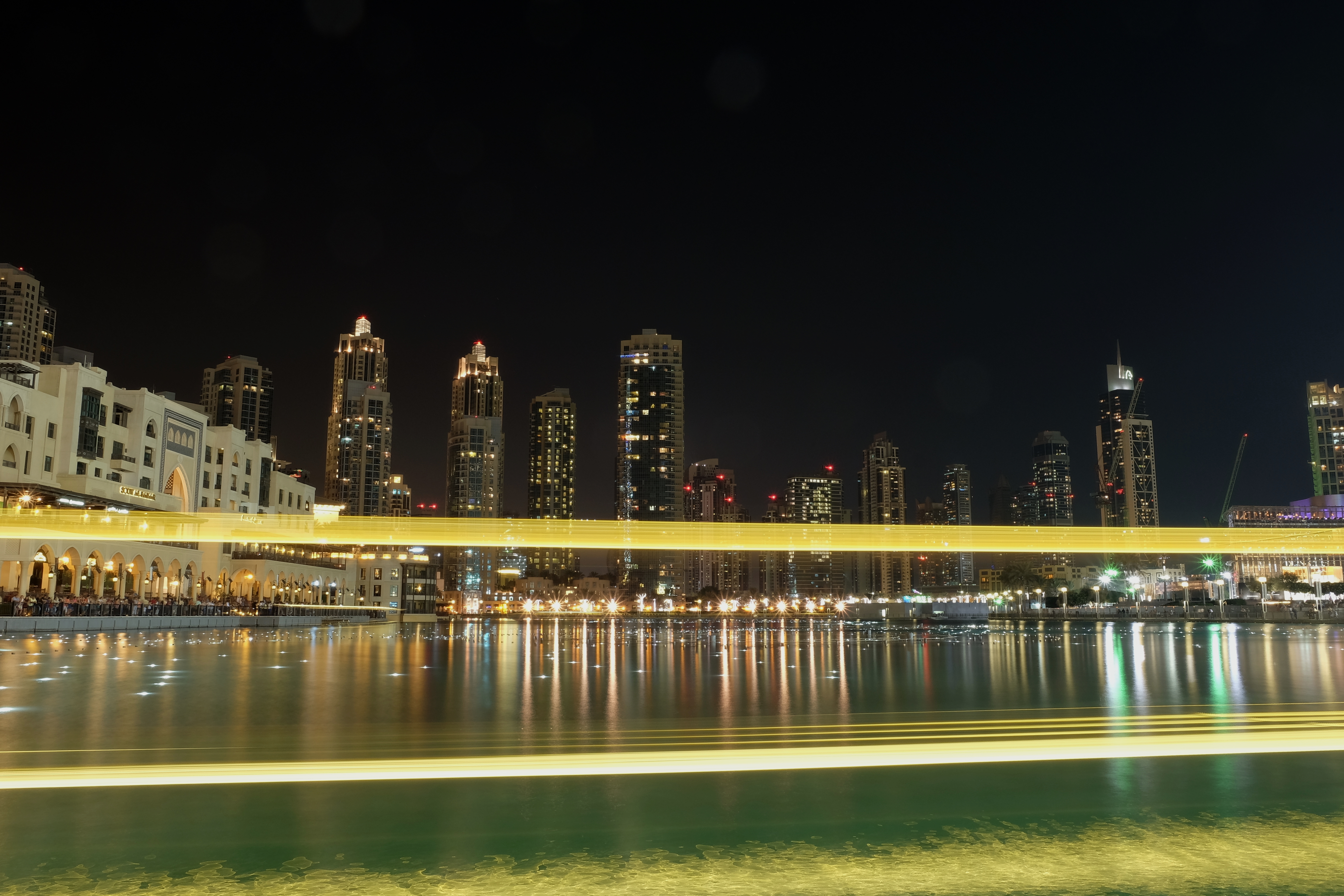 The Dubai Fountain performing at dusk, free to watch from the promenade