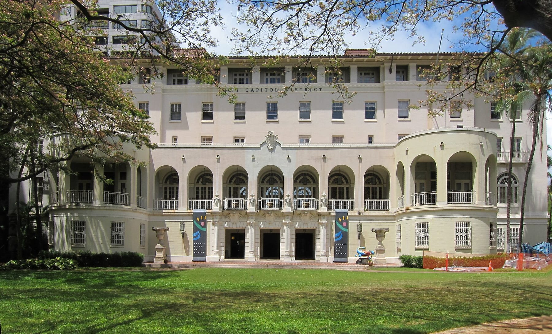 The cream-colored No. 1 Capitol District Building in downtown Honolulu, which houses Capitol Modern, seen across its front lawn
