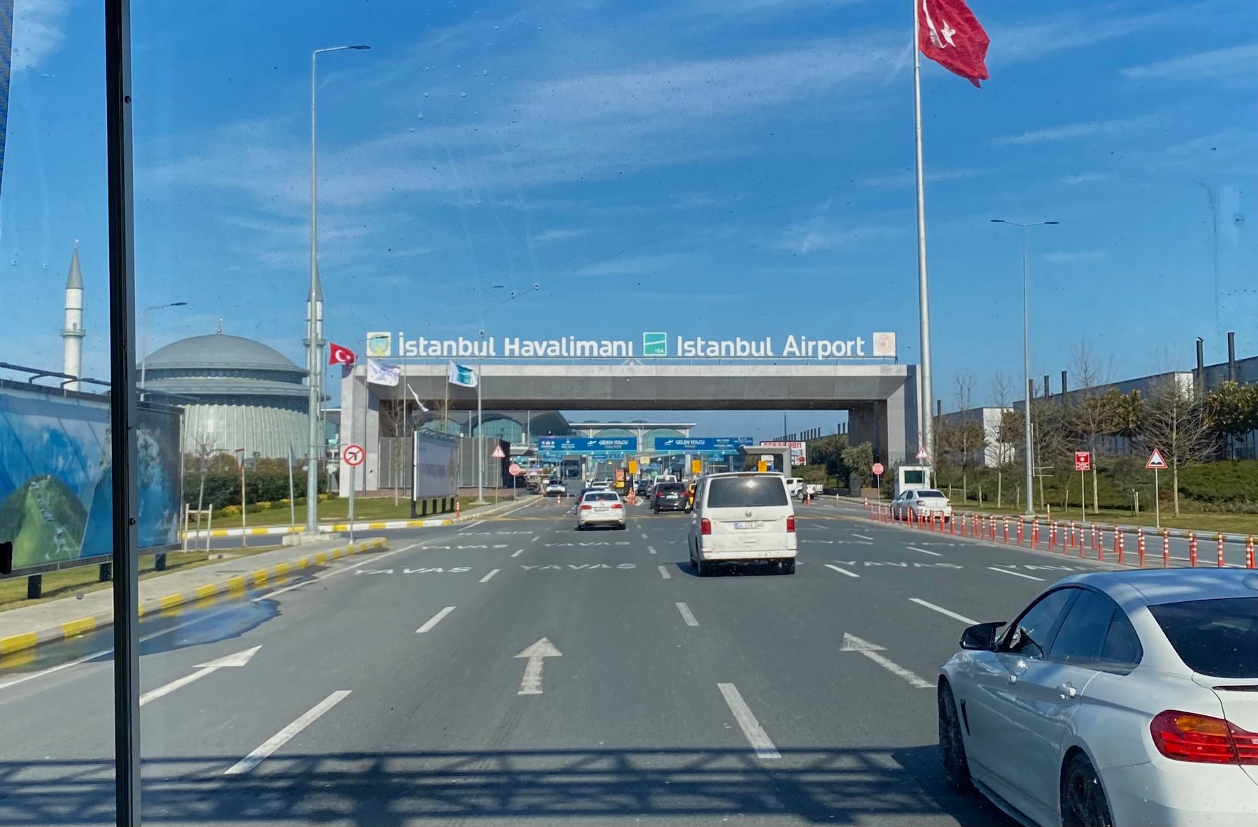 A wide exterior view of Istanbul Airport's terminal and forecourt