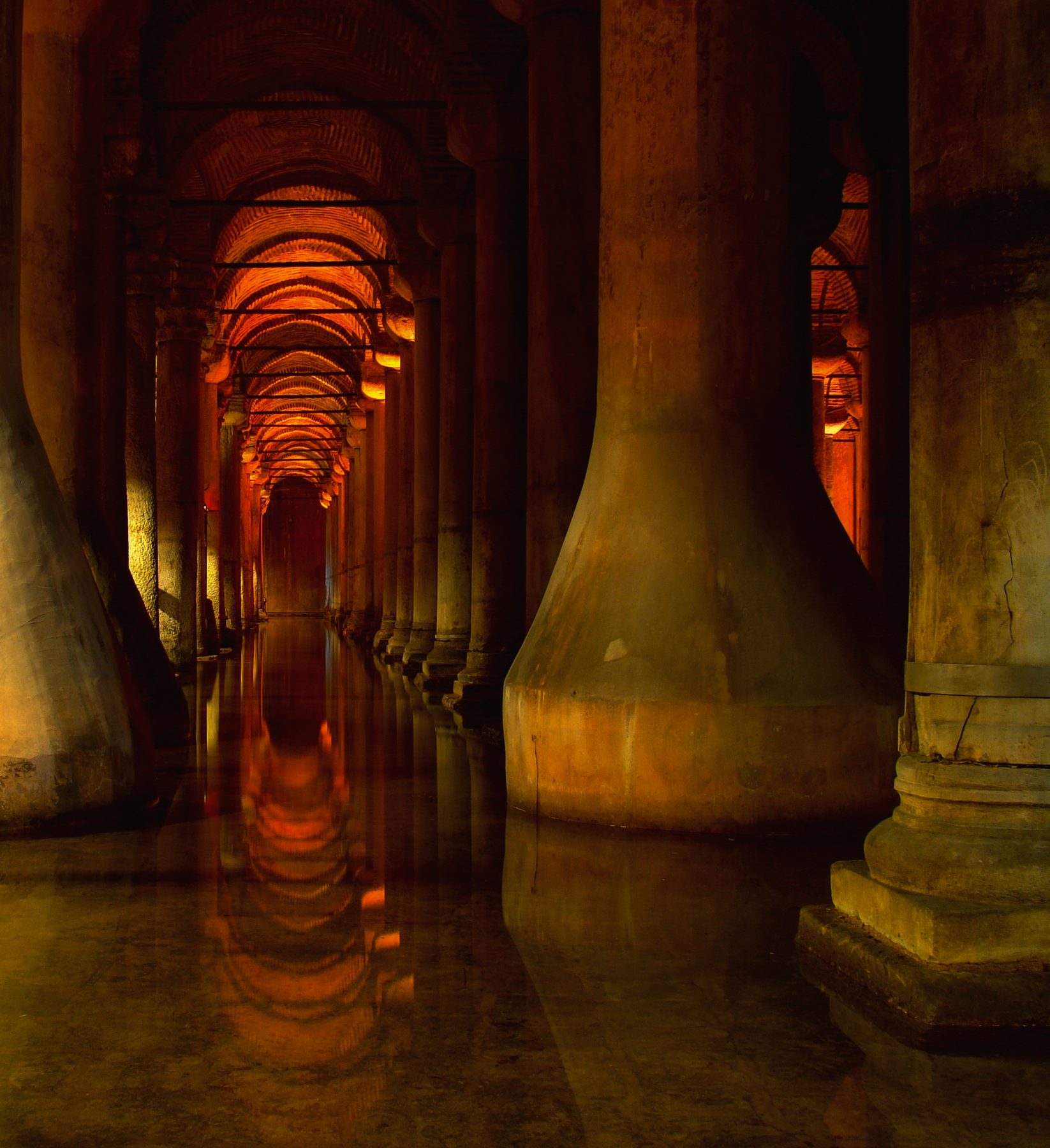 A lamplit colonnade of the Basilica Cistern reflected in its water, the Byzantine stop on this four-ticket route