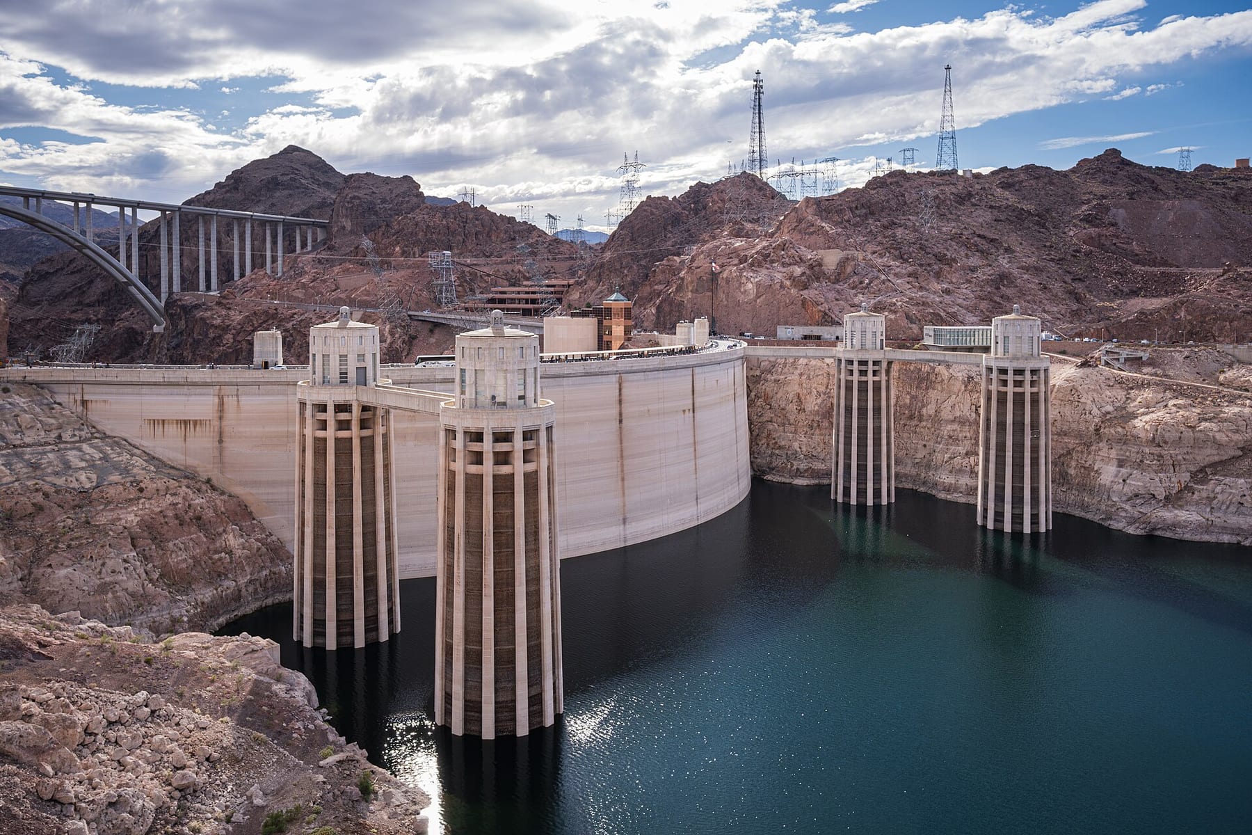 The Hoover Dam wall, intake towers and the Mike O’Callaghan–Pat Tillman Memorial Bridge above Lake Mead