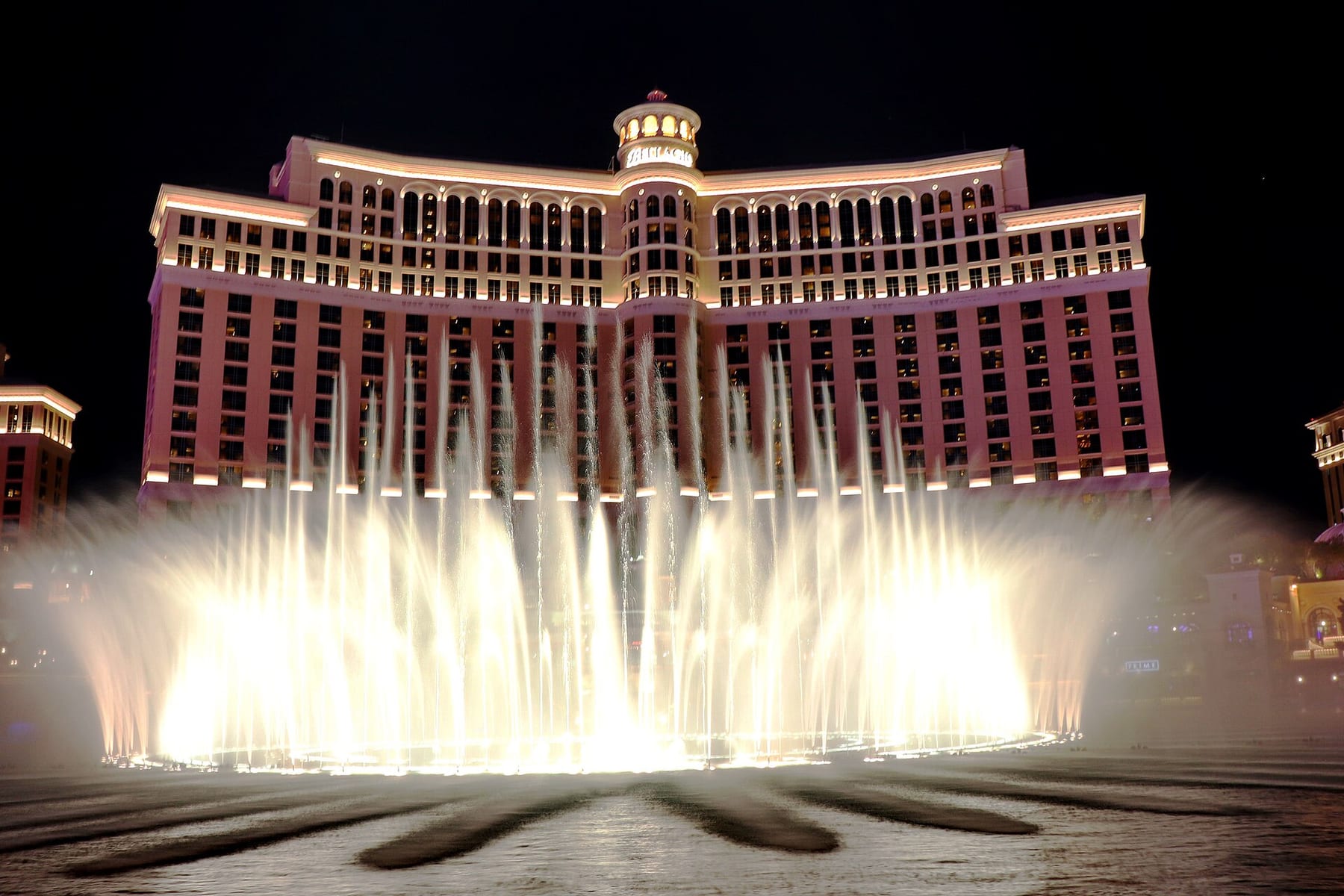The Fountains of Bellagio in a night display, with the hotel’s front rising behind the jets