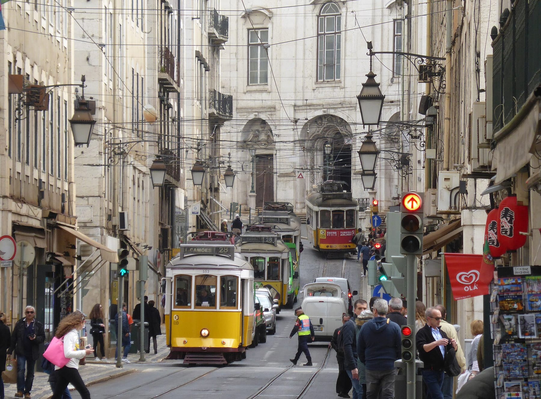 Trams on route 28 queuing on Rua da Conceição in Baixa, Lisbon, the front tram signed for Luís Camões