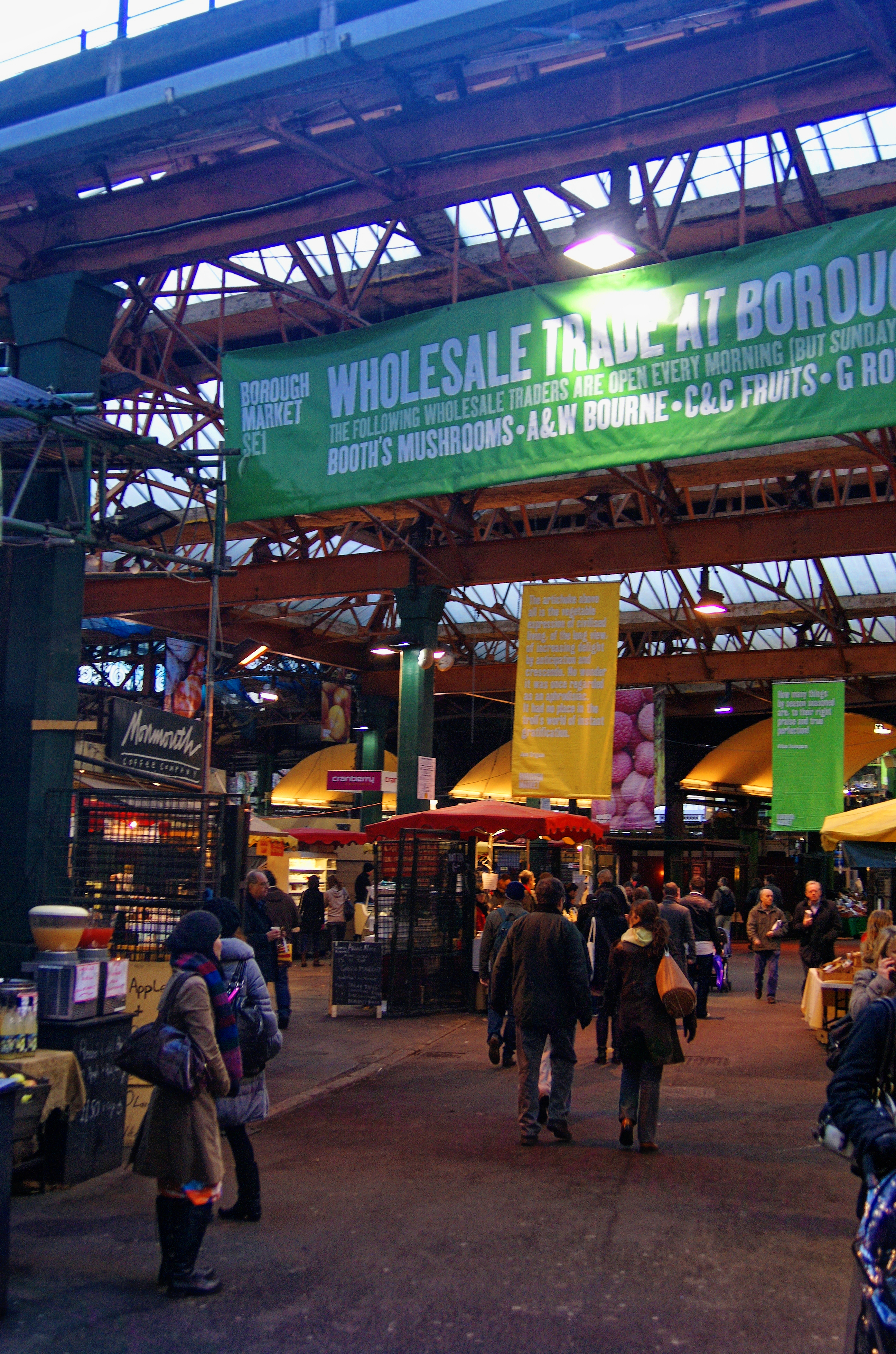 Stalls under the railway arches at Borough Market, free to browse