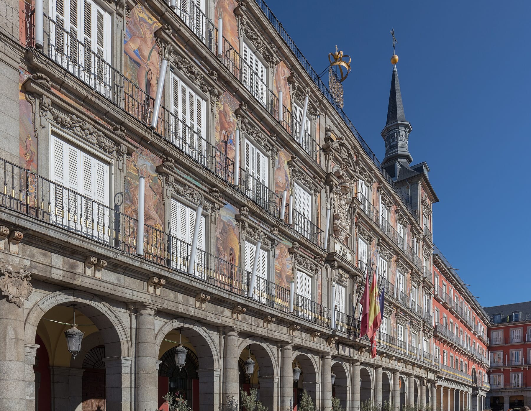 The painted facade and arcades of the Casa de la Panadería on Plaza Mayor, Madrid